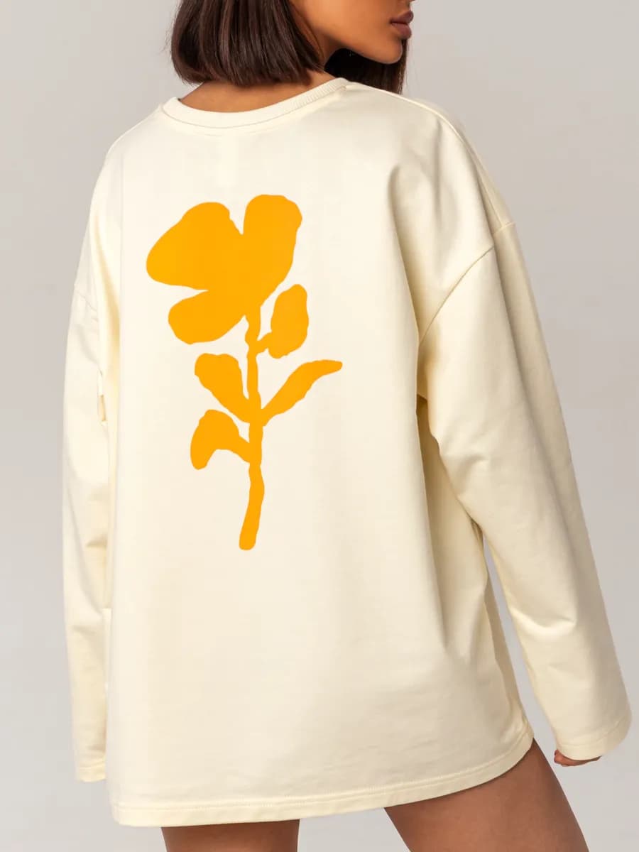 Лонгслив оверсайз сливочный с принтом Цветок