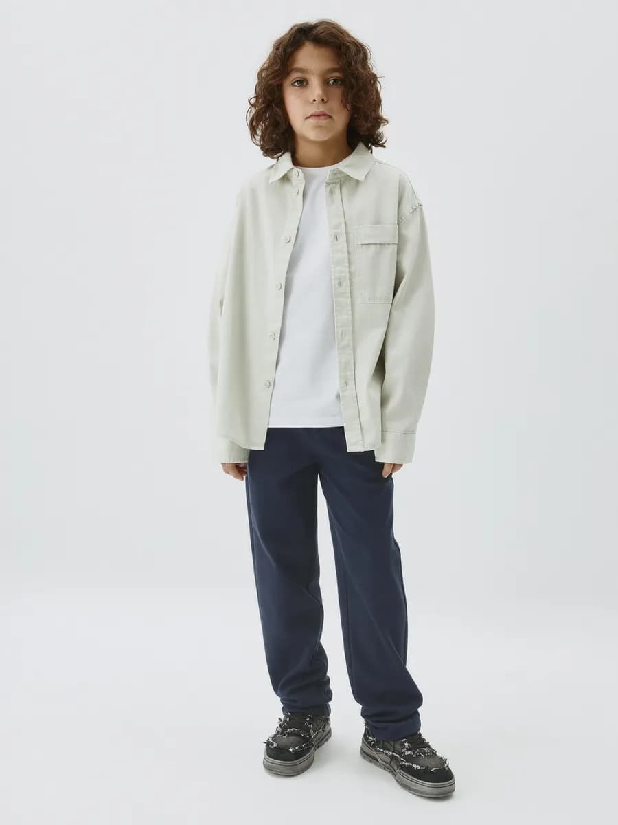 Школьные брюки трикотажные прямые на резинке - фото 1