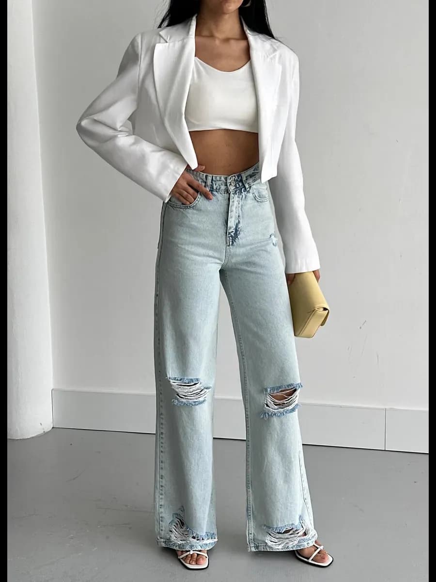 Джинсы широкие расклешенные рваные на коленях трубы