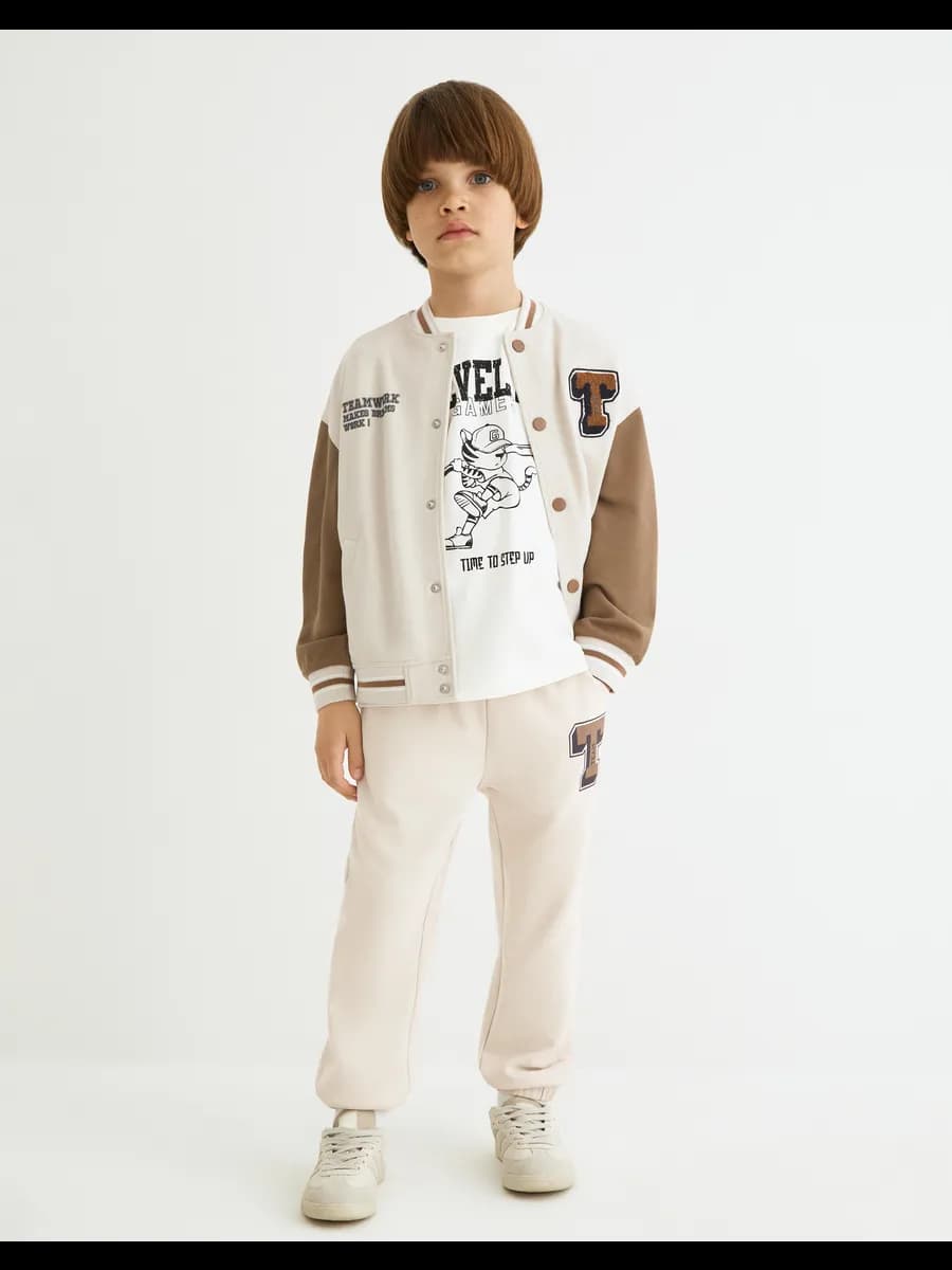 Светло-бежевые спортивные брюки oversize с принтом