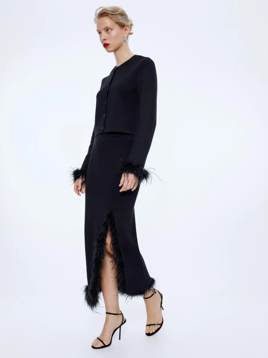 Вязаная юбка миди черная вечерняя с перьями
