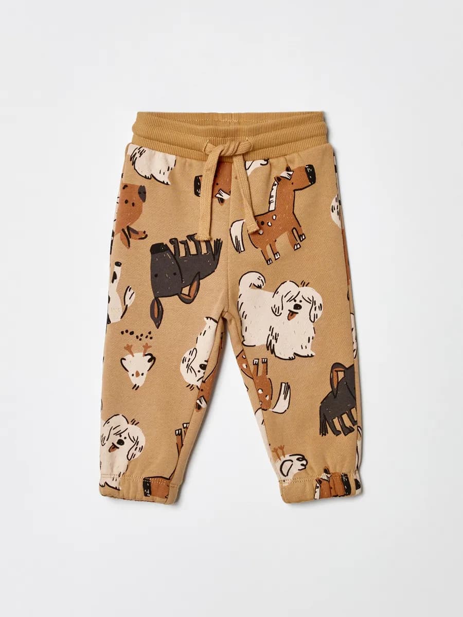 Трикотажные брюки джоггеры утепленные с принтом - фото 1